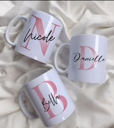 three personalized coffee mugs on a white blanket