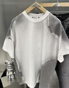 Luxury Washed Tops For Streetwear, Trendy Distressed T-shirt For Streetwear, Trendy Patchwork T-shirt For Streetwear, White Patchwork T-shirt For Streetwear, Patchwork Relaxed Fit T-shirt For Streetwear, White Distressed T-shirt For Streetwear, Tshirt Deconstruction, Washed Cotton T-shirt For Streetwear, Faded Screen Print T-shirt For Streetwear