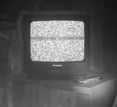 an old television sitting on top of a table