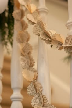 some paper garlands are hanging from the banister
