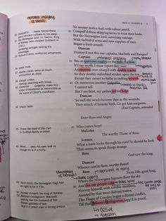 an open book with writing on it and some words written in red ink above the pages