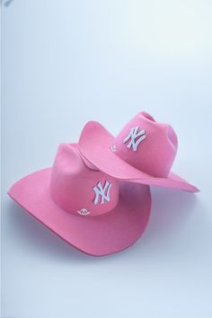 New York Cowboy Hat / Pink Pink Fitted Hat For Rodeo, Pink Cowboy Boots And Hat, Ny Cowboy Hat, Pink Whitney Cowgirl Hat, New York Cowboy Hat, Baby Pink Cowboy Hat, Pink Whitney Cowboy Hat, Beyonce Pink Cowboy Hat, Pink Brimmed Hat For Rodeo