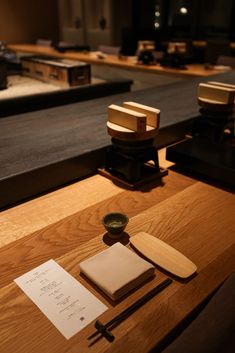 a wooden table topped with lots of books