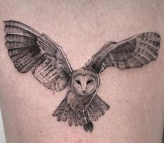 an owl tattoo is shown on the thigh