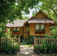 a small wooden house surrounded by trees and flowers
