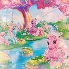 there are many little ponys playing in the water under a tree with rainbows