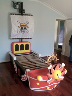 a child's bedroom with a pirate ship bed