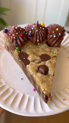 a slice of chocolate chip cookie pie on a paper plate with sprinkles