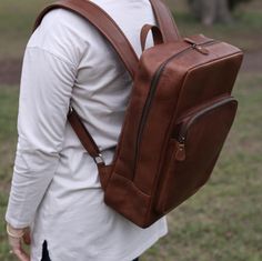 Made with best quality cowhide leather - premium quality Brown color leather backpack - laptop bag - work bag - travel bag for men Ideal for corporate gift, groomsmen gifts We ship the orders next business day - Free shipping for orders over $35 Classic Backpack With Waxed Finish For Everyday Use, Classic Waxed Finish Backpack For Everyday, Leather Backed Backpack For Everyday Use, Leather Laptop Bag With Large Capacity, Standard Backpack With Waxed Finish For Daily Use, Brown Leather Backpack With Luggage Sleeve, Rectangular Leather Backpack For School, Brown Leather Backpack For Everyday, Brown Satchel Backpack For Everyday Carry