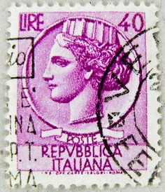 a stamp with an image of a woman in purple and black on the reverse side