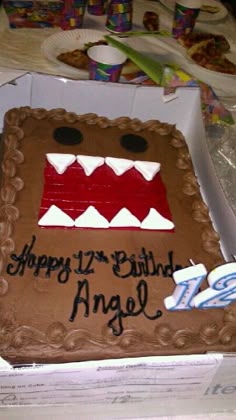 a birthday cake that is shaped like an angry monster's face with the words happy 17th birthday angel on it