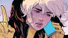 a woman talking on a cell phone while holding her hand up to the side with one finger