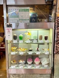 a display case filled with lots of cupcakes
