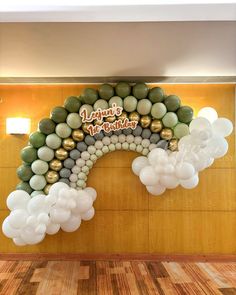 balloons are arranged in the shape of a rainbow