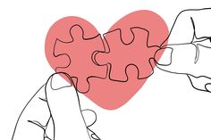 two hands holding puzzle pieces in the shape of a heart with one hand touching it