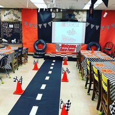 a room filled with lots of tables covered in black and white checkered cloths
