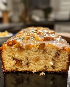 a loaf of cake with icing sitting on top of a counter