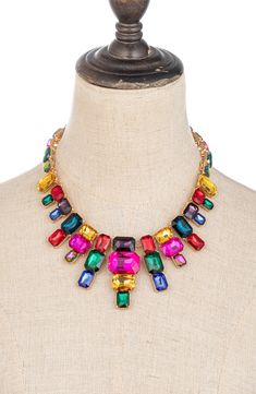 Rainbow crystals bring colorful sparkle to a dazzling statement necklace crafted in glossy goldtone plate. 12" length; 2" extender Lobster clasp closure Goldtone plate/glass Imported Multicolor Embellished Party Necklace, Cheap Rainbow Statement Jewelry, Bohemian Multicolor Stone Crystal Necklace, Festive Multicolor Jeweled Necklace, Multicolor Costume Jewelry Necklace, Matilda Costume, Luxury Multicolor Statement Necklaces, Multicolor Statement Necklace, Multicolor Crystal Rhinestone Costume Necklace