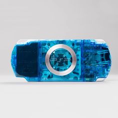an electronic device made out of plastic and blue material with metal parts on the side