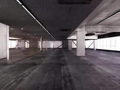 an empty room with wooden floors and white walls is pictured in this black and white photo