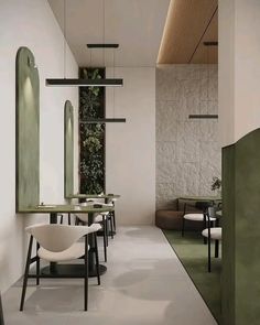 the interior of a restaurant with tables and chairs in white, green and black colors