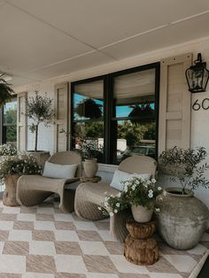 the front porch is clean and ready to be used for relaxing on summer days,