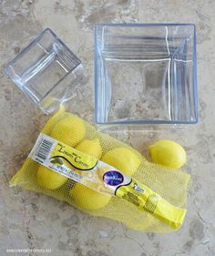 a bag of lemons next to some plastic containers