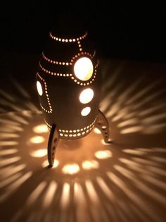 a light that is sitting on top of a table with some lights in the background