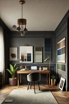 an office with dark walls and wooden floors, artwork on the wall, and a desk