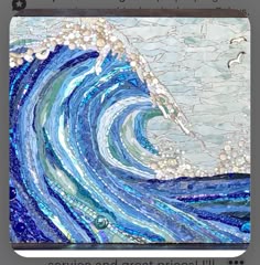 an art project with blue and white waves in the ocean, made from stained glass