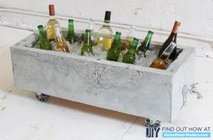 a metal container filled with lots of bottles