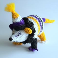 a crocheted stuffed animal with a hat on it's head