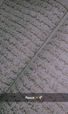 an open book with arabic calligraphy on it's cover and the words peace written in two different languages