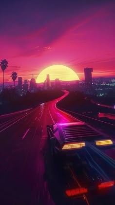 the sun is setting over a highway with cars driving on it and palm trees in the background