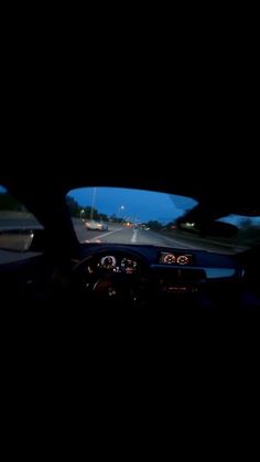 the dashboard of a car at night time