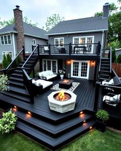 an outdoor deck with seating and fire pit