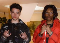 two young men standing next to each other