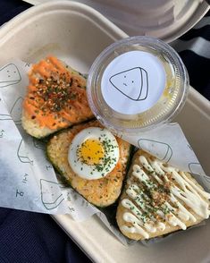 a plastic container filled with food on top of a table