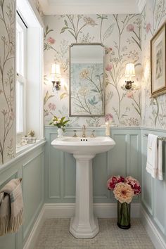 Explore this beautifully decorated half bathroom featuring a stylish pedestal sink and floral wallpaper that adds a touch of elegance! #HalfBathroom #BathroomDecor Bathroom Wallpaper One Wall, Bathroom With Half Wallpaper, Wallpaper For Toilet Room, Floral Wallpaper For Bathroom, Bathrooms With Wall Paper, Small Bathroom With Wallpaper Half Baths, Half Wall Wallpaper Bathroom, Wallpaper Backgrounds Bathroom, Bathroom With Wallpaper Ideas