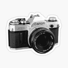 a black and white photo of a canon camera sticker on a white background with the word canon written in it