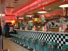 diners are lined up at the checkered counter