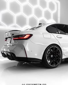 the rear end of a white sports car