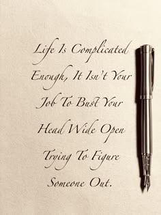 a pen sitting on top of a piece of paper next to a writing sample that says, life is complicated enough if it's not your