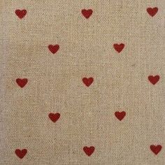 red hearts on beige fabric with white background