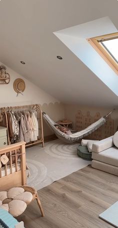 an attic bedroom with a hammock and bed