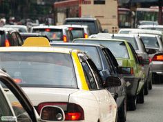 a lot of cars that are sitting in the street