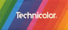 the technicolor logo is displayed on a rainbow colored background with vertical stripes