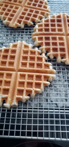 three waffles sitting on top of a cooling rack