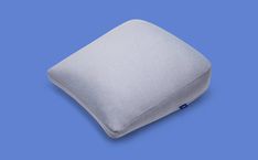 a white pillow on a blue background