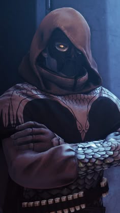 a man in a hoodie with his arms crossed and hands folded over his chest